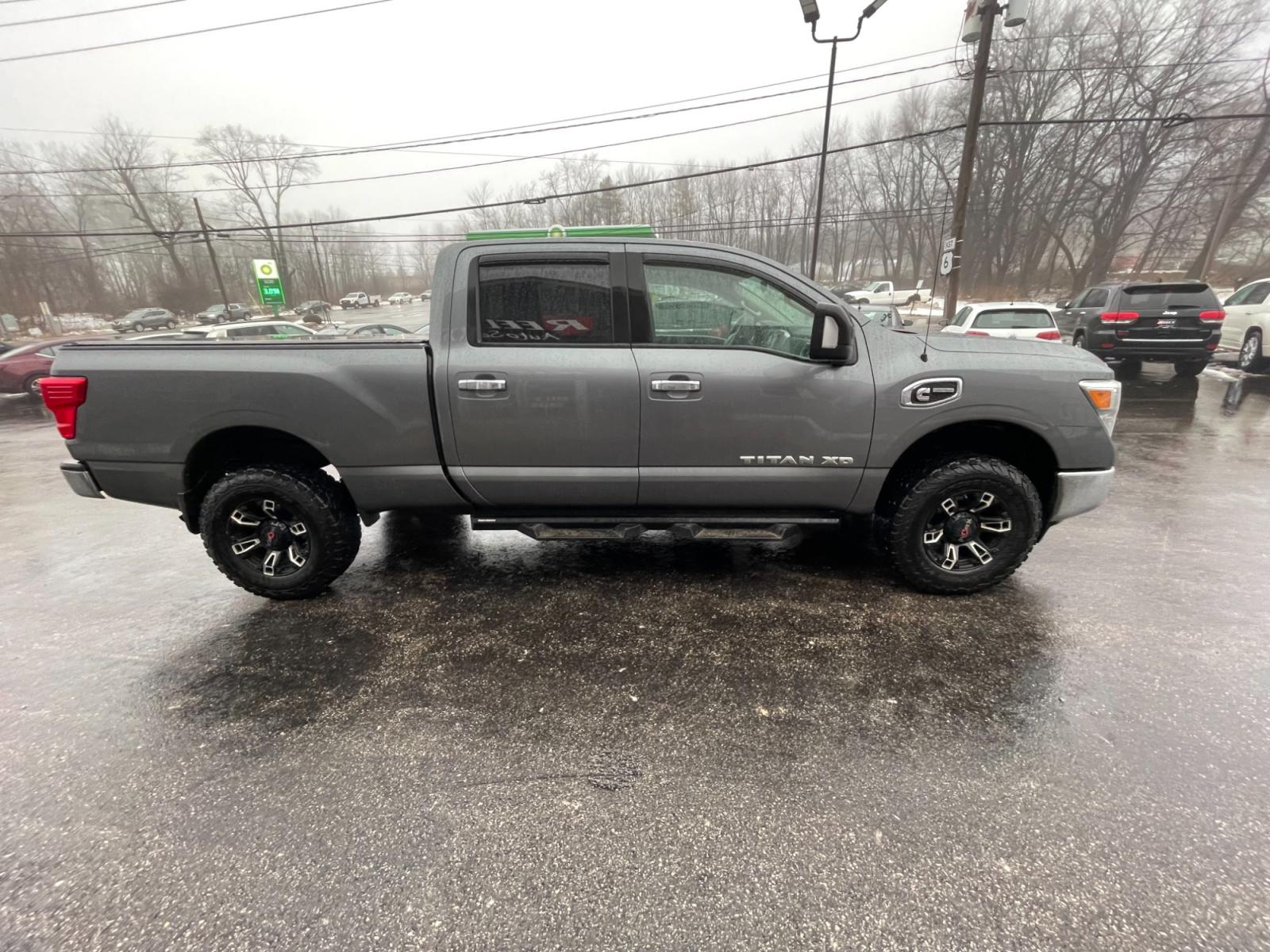 2017 Silver /Black Nissan Titan XD SV 4WD Diesel (1N6BA1F33HN) with an 5.0L V8 DOHC 32V DIESEL engine, 6A transmission, located at 11115 Chardon Rd. , Chardon, OH, 44024, (440) 214-9705, 41.580246, -81.241943 - This 2017 Nissan Titan XD SV Crew Cab featuring the 5.0 Cummins V8 diesel engine and a 6-speed Aisin transmission is a robust full-size pickup truck designed for heavy-duty tasks. As a one-owner vehicle, it suggests a potentially well-maintained history, and with a significant towing capacity of 12, - Photo #7